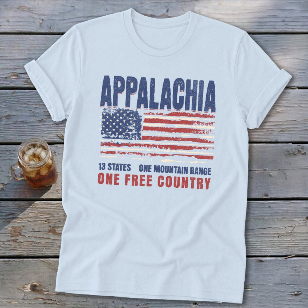 Light blue t-shirt displaying a distressed American flag graphic with Appalachia text on wooden planks.