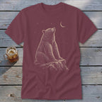 Bear sitting on a rock looking at the moon and stars.
