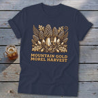 Dark blue t-shirt with "Mountain Gold Morel Harvest" text and a Morel mushroom illustration.