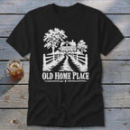 Black t-shirt with white graphic of a house, trees, fence, and text "OLD HOME PLACE".