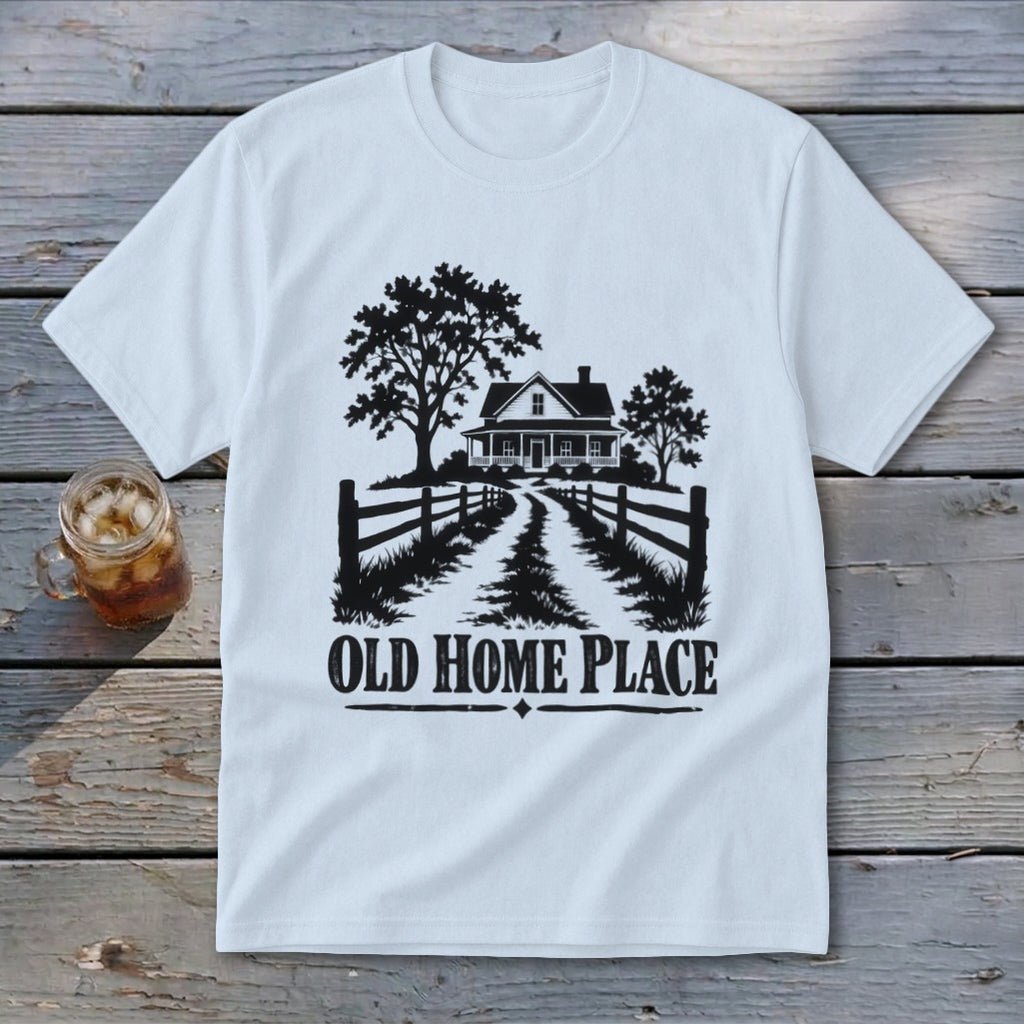 White t-shirt with a black graphic of a farmhouse, trees, fence, and text "OLD HOME PLACE".