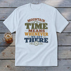 White t-shirt with "Mountain Time Means Whenever We Get There" graphic and a clock.