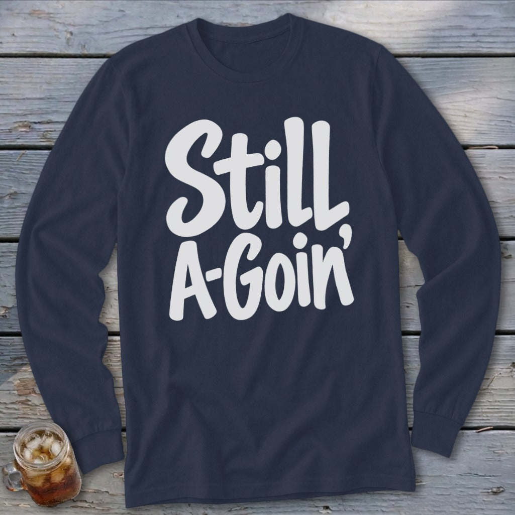 Navy blue long-sleeve shirt with the white text Still A-Goin centered on the chest.