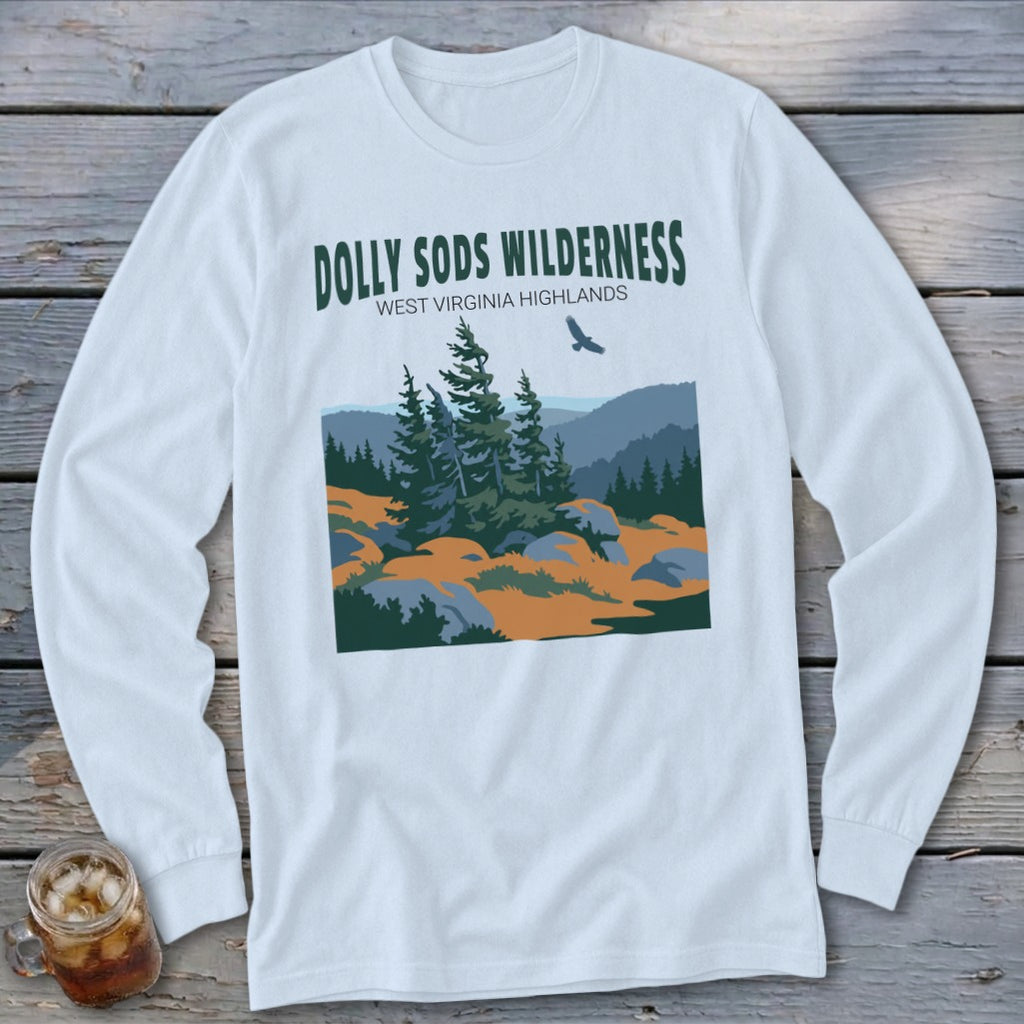 A long-sleeved white t-shirt featuring a green graphic of the Dolly Sods Wilderness landscape with mountains and trees.