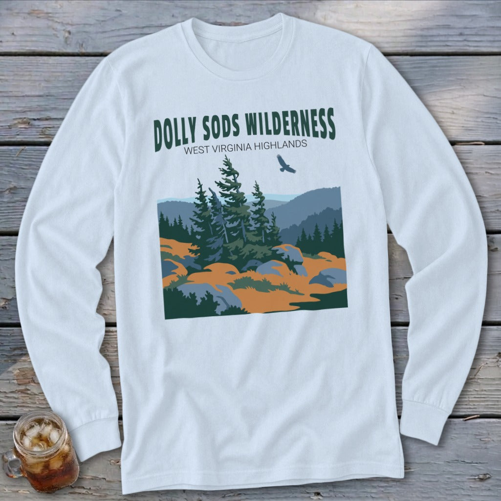 A long-sleeved white t-shirt featuring a green graphic of the Dolly Sods Wilderness landscape with mountains and trees.