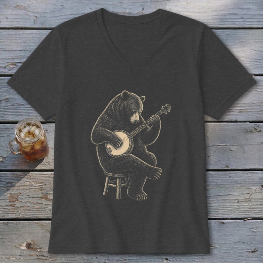 Black bear playing banjo while sitting on a stool, on a dark t-shirt.