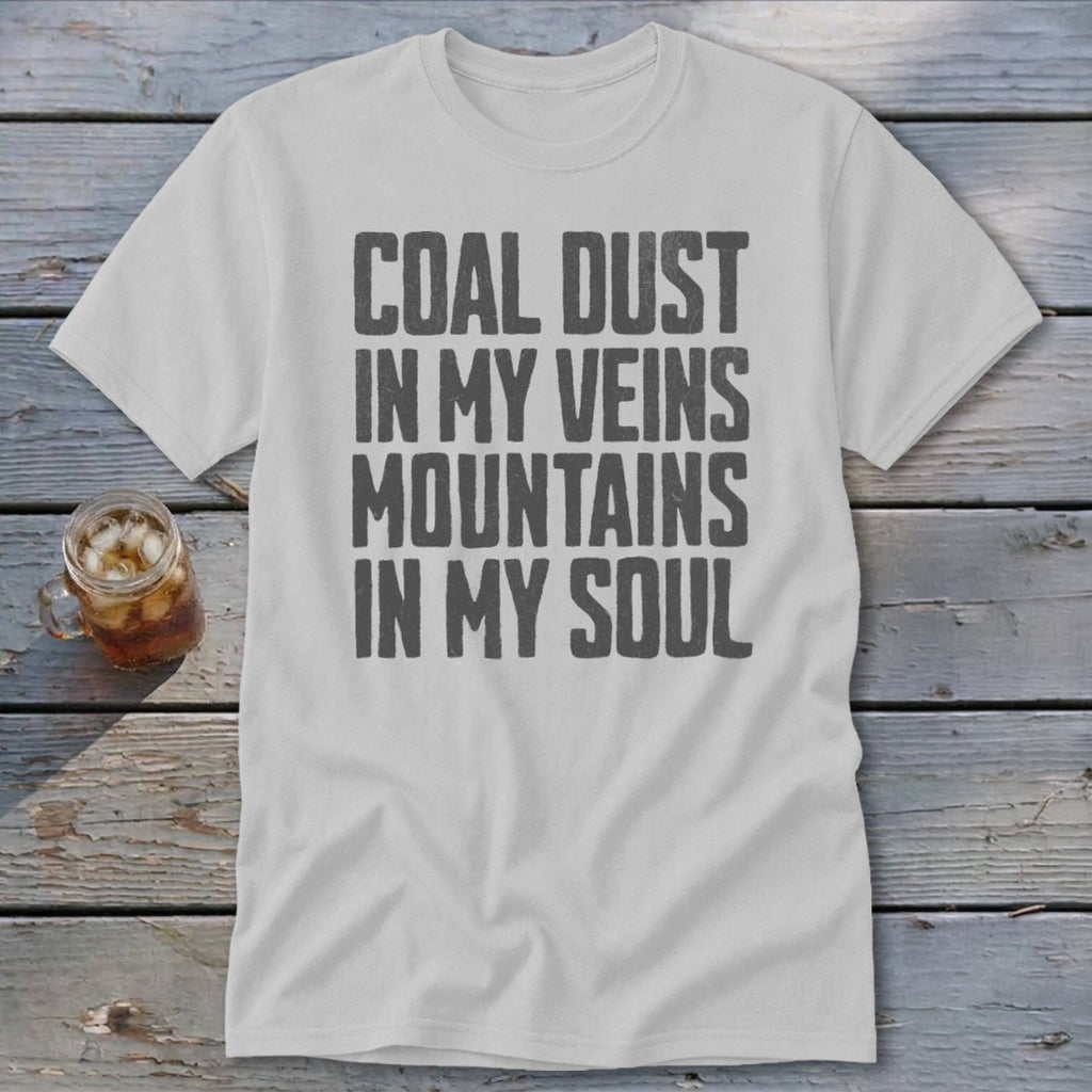 A light gray crewneck t-shirt features black text that reads COAL DUST IN MY VEINS MOUNTAINS IN MY SOUL.