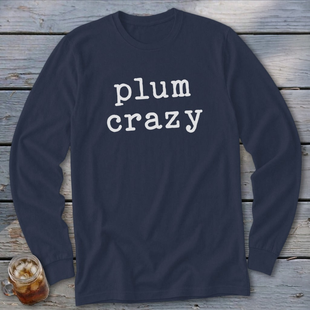 Navy long-sleeve shirt with white text reading "plum crazy."