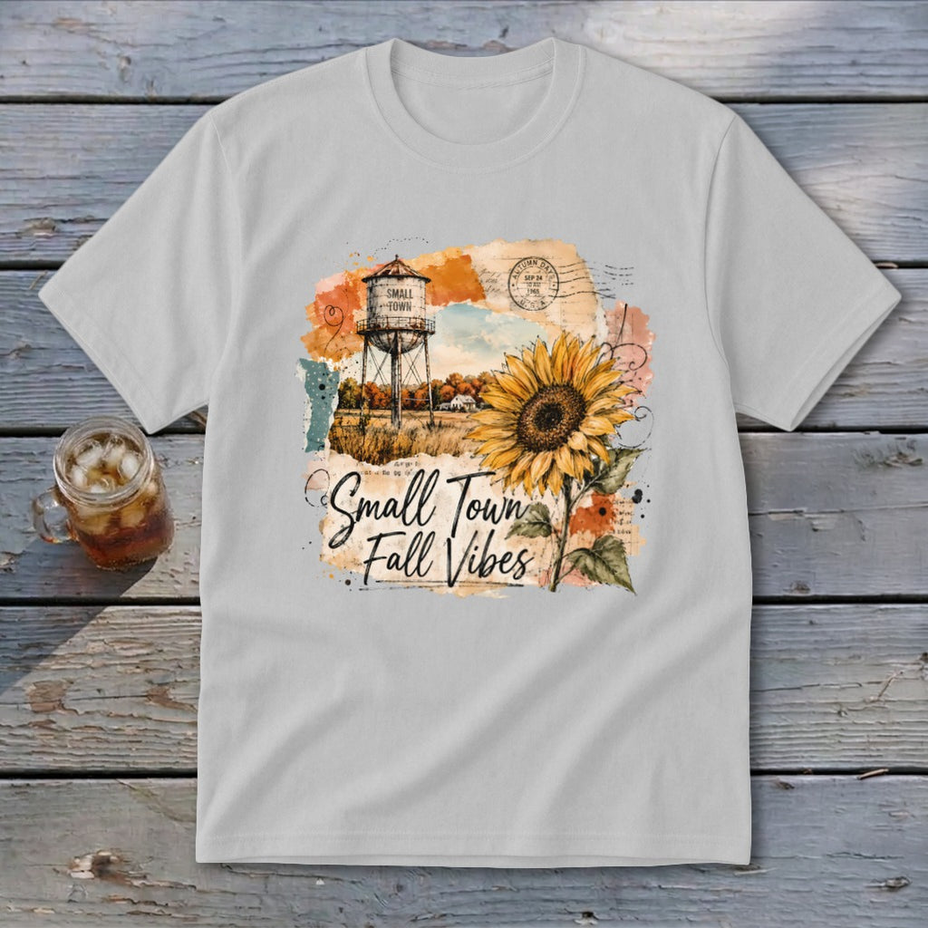 T-shirt with "Small Town Fall Vibes" text, water tower, and sunflower graphic.