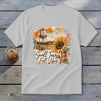 T-shirt with "Small Town Fall Vibes" text, water tower, and sunflower graphic.