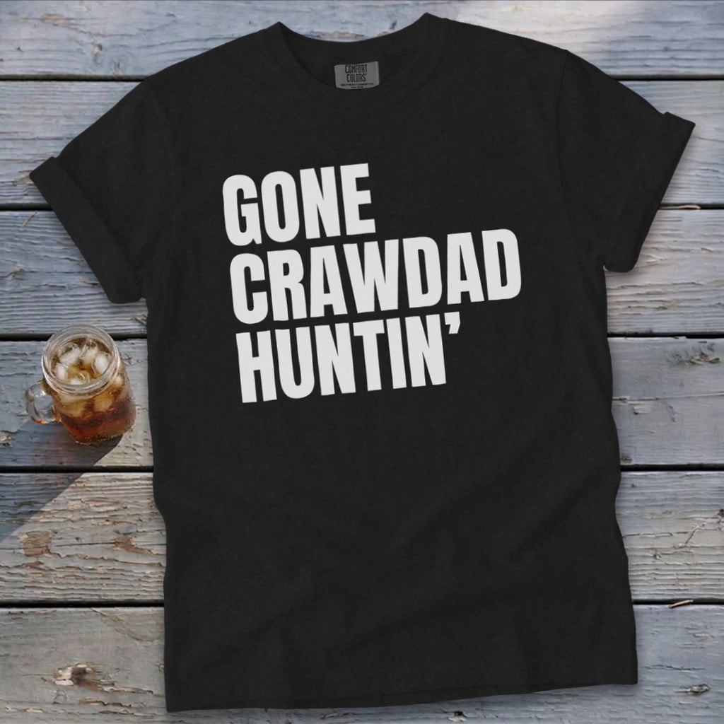 Black t-shirt with white text reading "GONE CRAWDAD HUNTIN'".