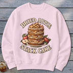 Pink sweatshirt with a dried apple stack cake and text graphic.