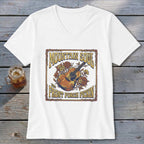 White t-shirt with a graphic featuring a guitar, flowers, and text "MOUNTAIN SOUL AND FRONT PORCH PICKIN'".