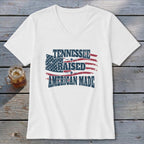 White v-neck t-shirt with distressed American flag graphic and text.