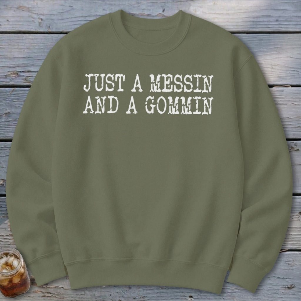 Olive green sweatshirt with white text that reads "JUST A MESSIN AND A GOMMIN".