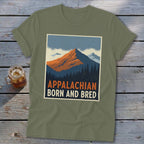 Olive green t-shirt featuring a retro mountain graphic with the text Appalachian Born and Bred.