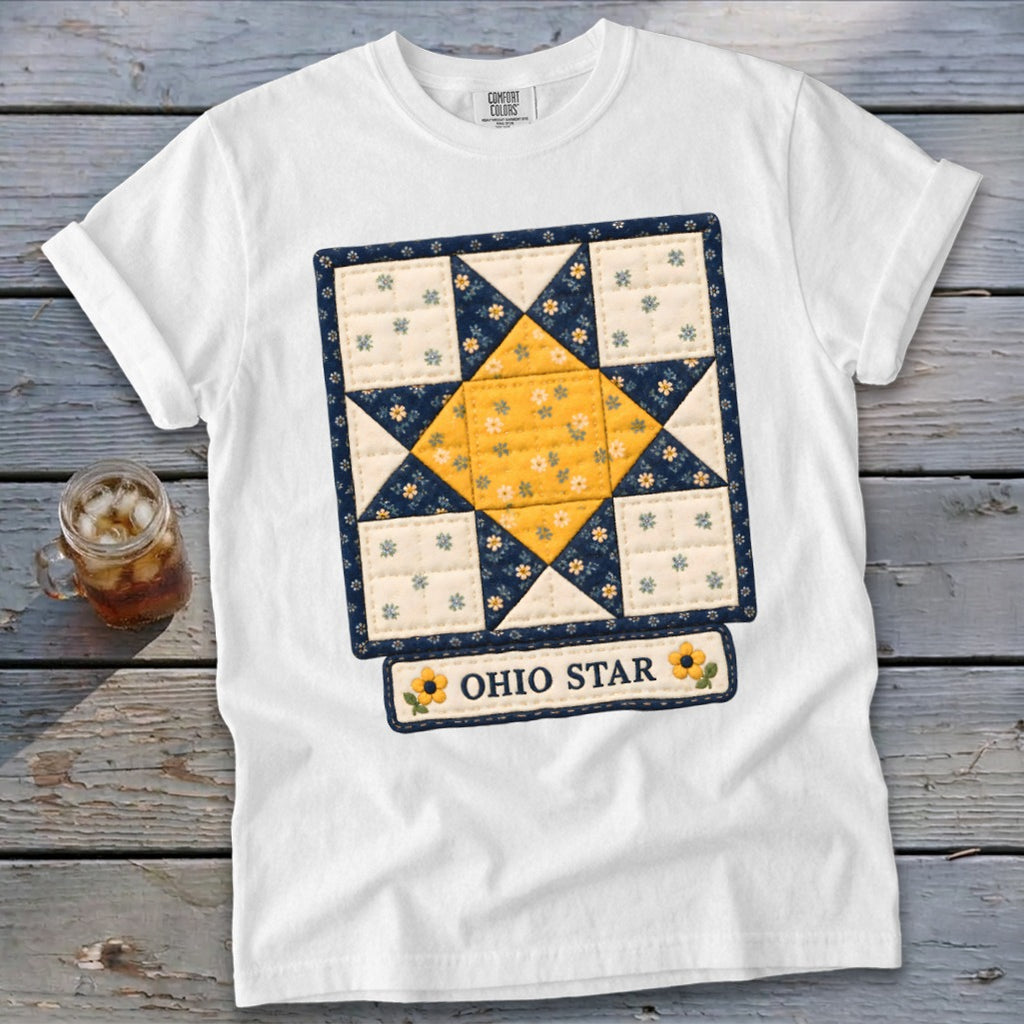 White t-shirt with a quilt-style Ohio Star graphic and sunflowers.