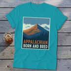 A turquoise t-shirt featuring a mountain graphic and the text "APPALACHIAN BORN AND BRED."