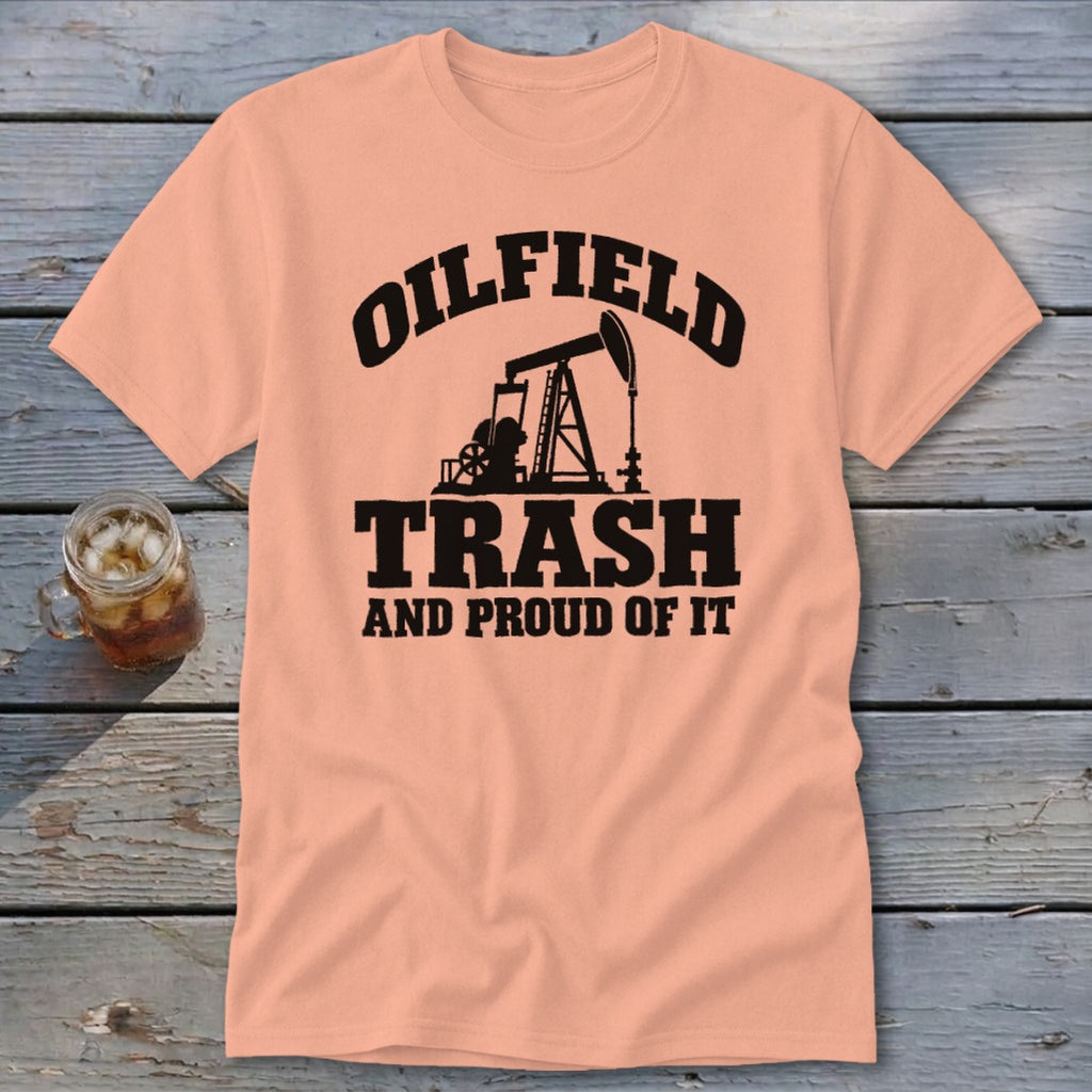 Peach t-shirt with black text and oil derrick graphic: "Oilfield Trash And Proud Of It."