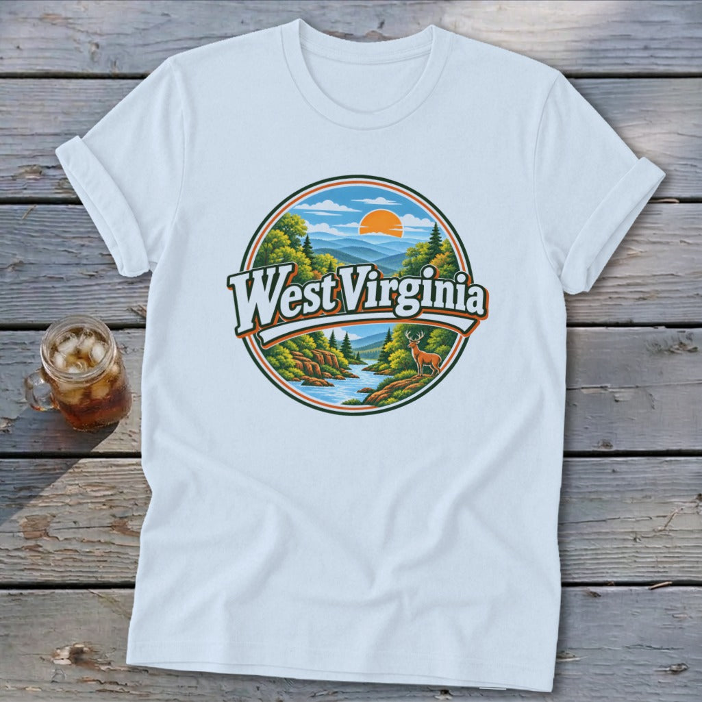 White t-shirt with a circular graphic featuring mountains, a river, trees, a deer, and "West Virginia" text.
