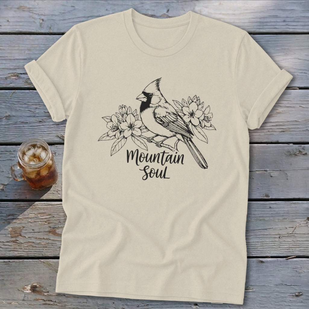 Cream t-shirt with black sketch of a cardinal perched on a branch with flowers and text "Mountain Soul".