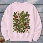 Pink crewneck sweatshirt with a detailed botanical print of pine, holly, berries, and cones.