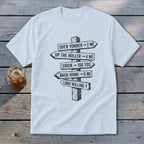 A light blue crewneck t-shirt featuring a black graphic of a rustic wooden signpost with directional text.