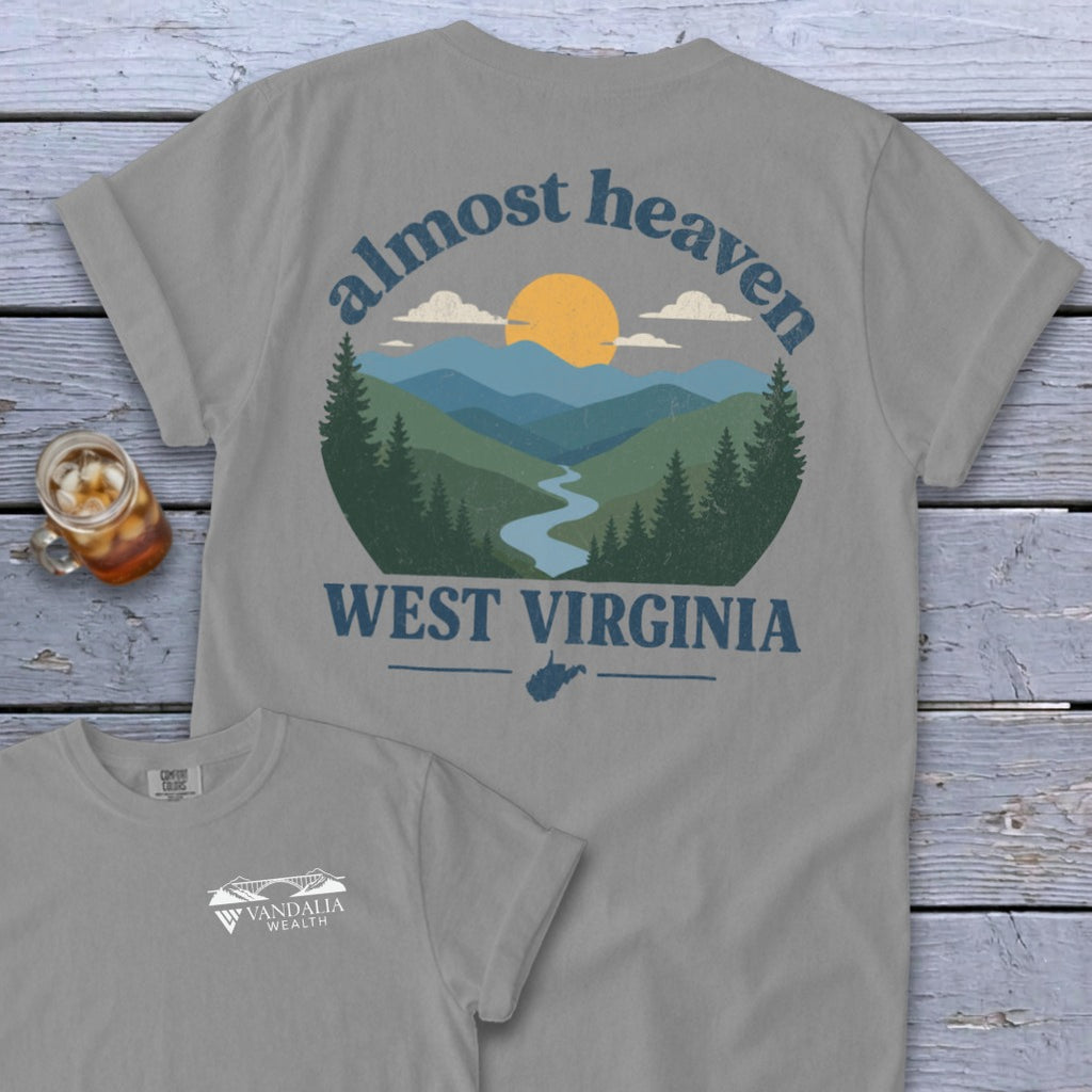 Gray t-shirt with "Almost Heaven West Virginia" scenic mountain landscape graphic.