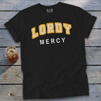Black t-shirt with "LORDY MERCY" text in yellow and white lettering.
