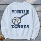 White crewneck sweatshirt featuring a blue graphic of a banjo and the text Mountain Echoes.