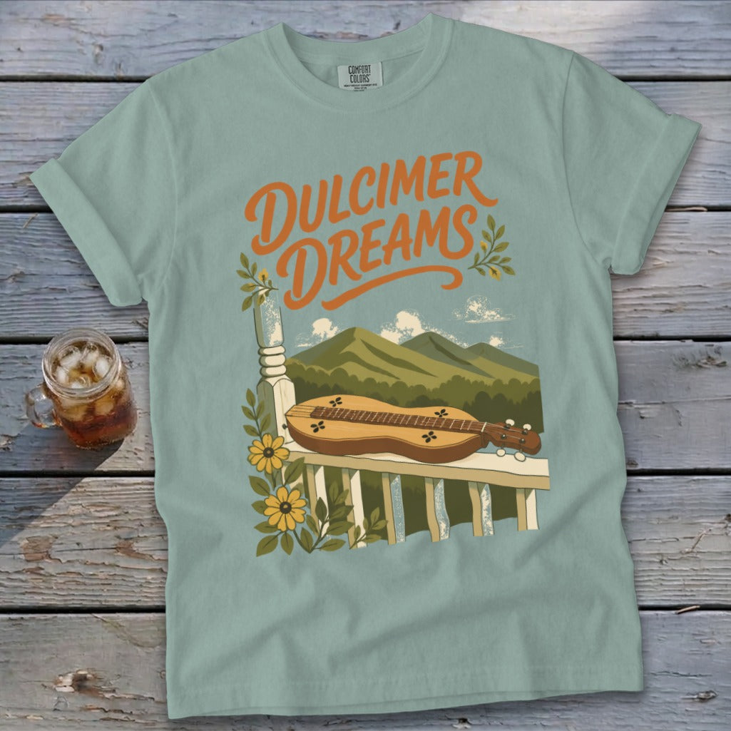 Light blue Comfort Colors t-shirt with "Dulcimer Dreams" text and mountain landscape.