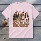 Light pink t-shirt with four dogs howling above the word "holler."