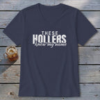 Navy v-neck t-shirt with white text that reads "THESE HOLLERS know my name".