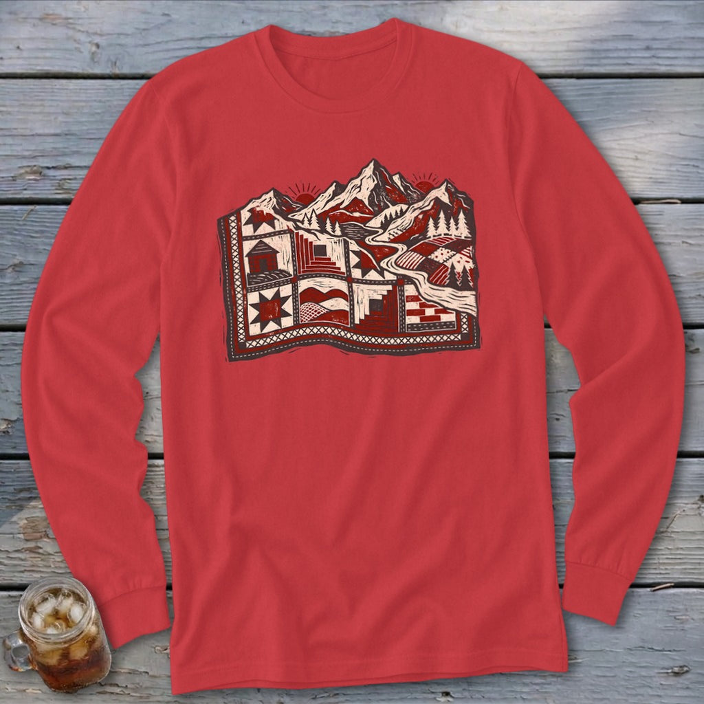 Red long-sleeve shirt with a graphic print of a mountainous landscape layered over a quilt pattern.