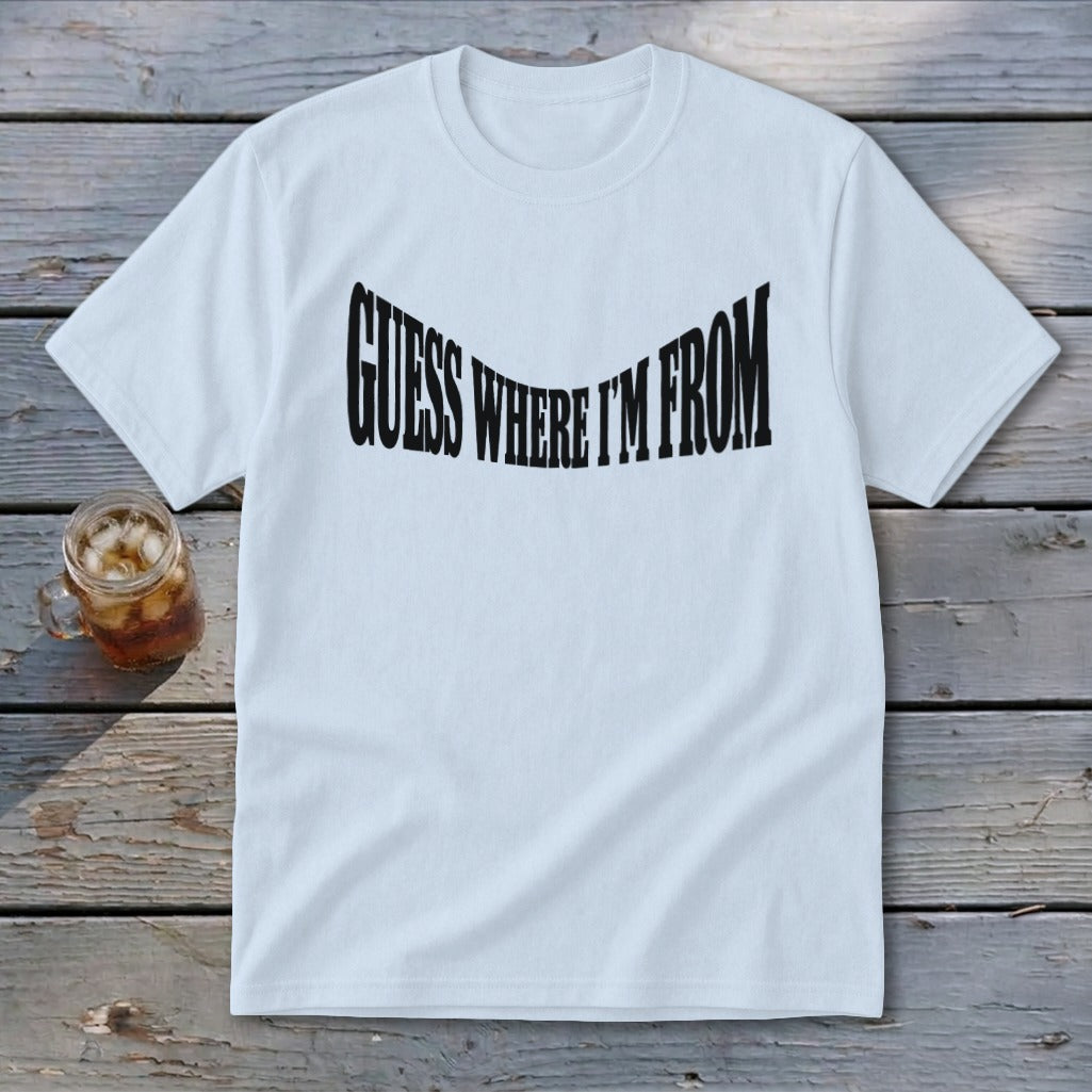 White t-shirt with black text that reads "GUESS WHERE I'M FROM" in a warped font.