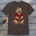 Groundhog wearing a red and black plaid shirt, front view, on brown t-shirt.