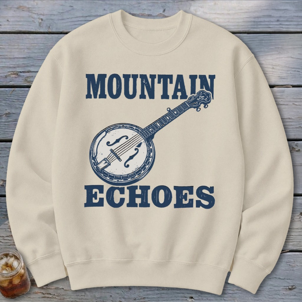 Beige crewneck sweatshirt featuring a blue graphic of a banjo and the text "MOUNTAIN ECHOES".