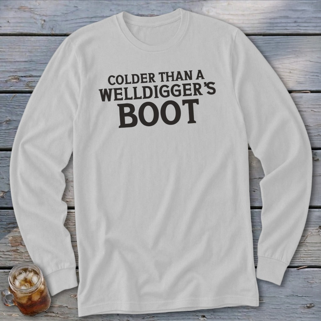 White long-sleeved shirt with "Colder Than A Welldigger's Boot" text.