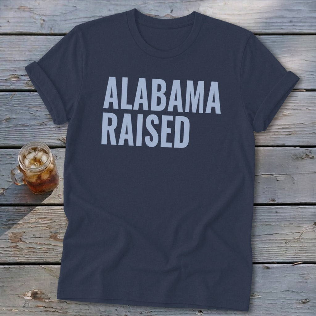 Dark blue t-shirt with "ALABAMA RAISED" in light gray text.