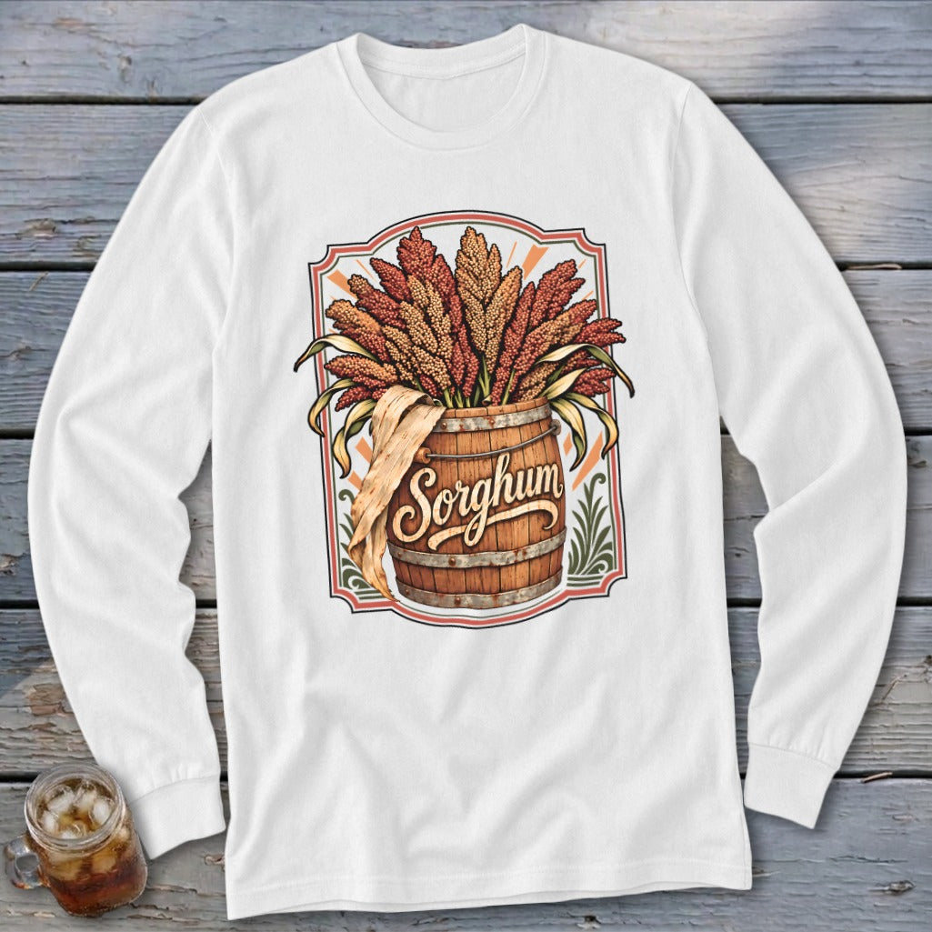 Long sleeve shirt with a wooden barrel overflowing with sorghum and the word "Sorghum."