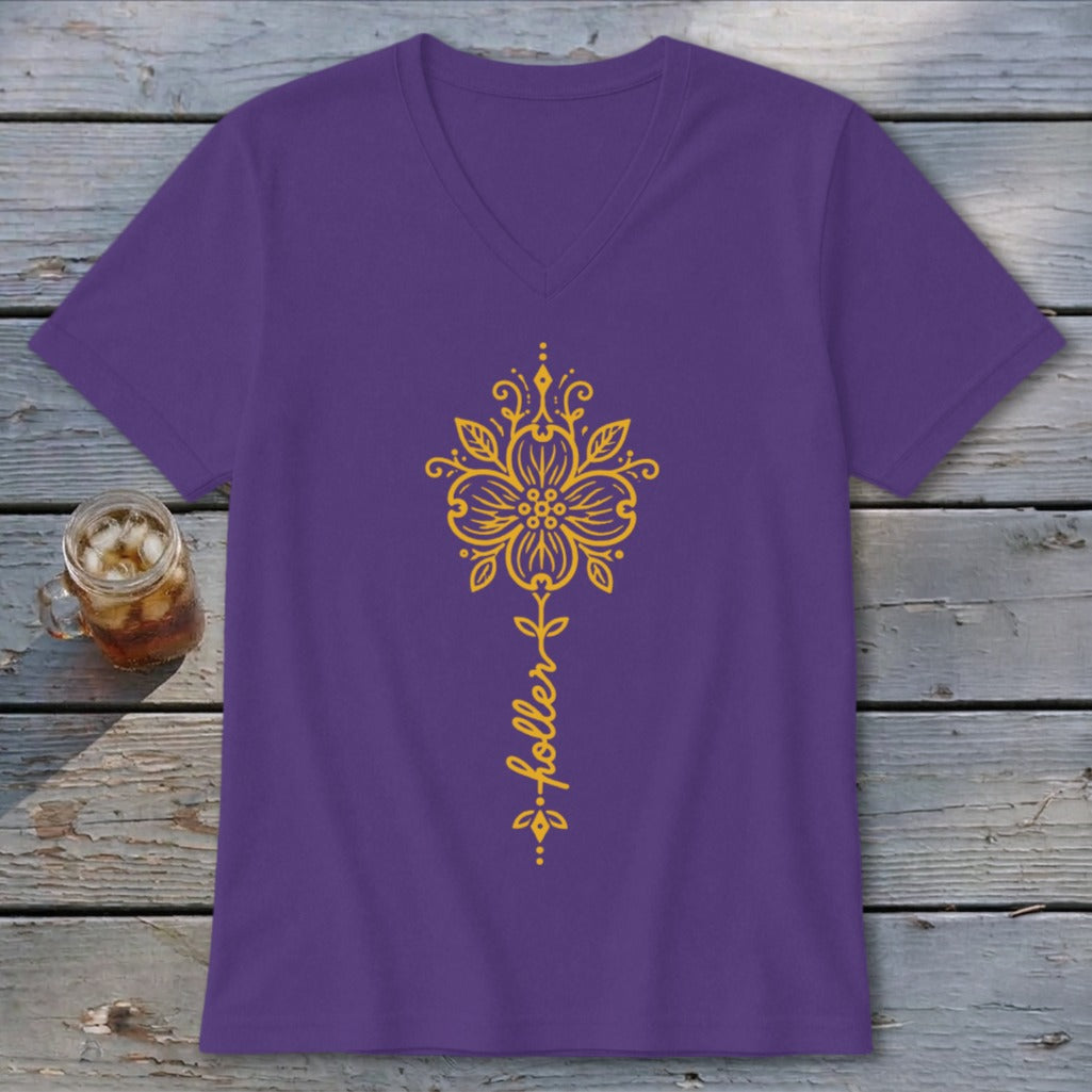 Purple v-neck t-shirt with gold floral design and "holler" text.