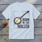 Light blue t-shirt with "BORN IN THE HOLLER" and banjo graphic.
