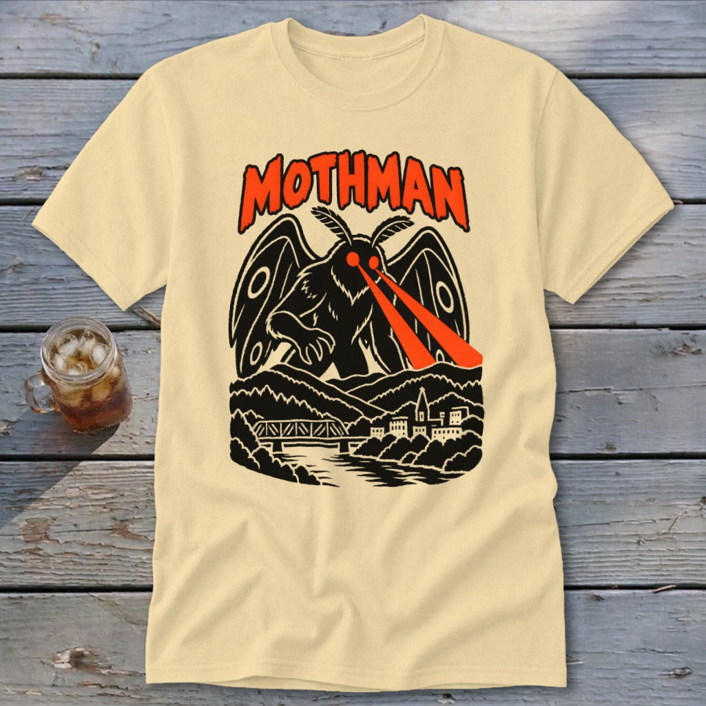 Cream t-shirt with black and orange Mothman graphic and text.