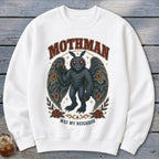 White sweatshirt with Mothman illustration and text "Mothman Was My Neighbor."