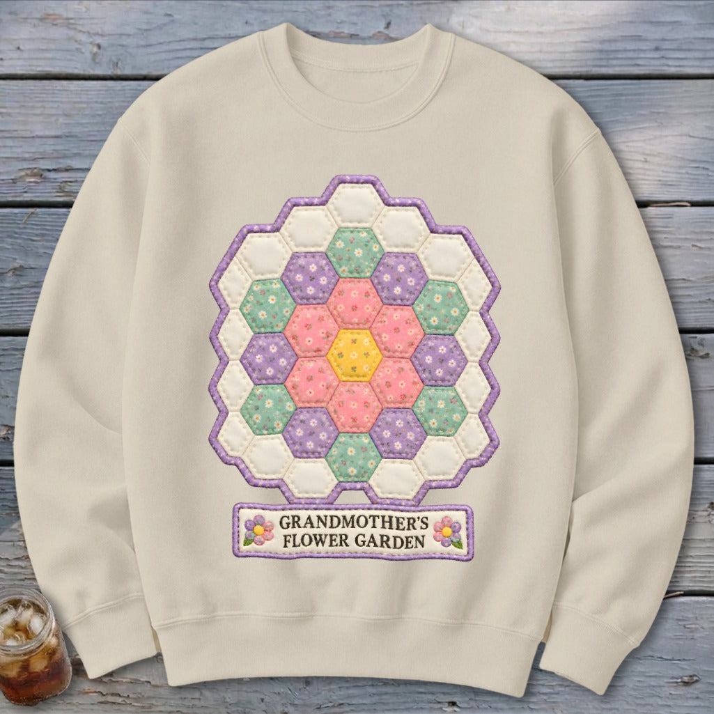 Cream sweatshirt with a hexagon quilt pattern and "Grandmother's Flower Garden" text.