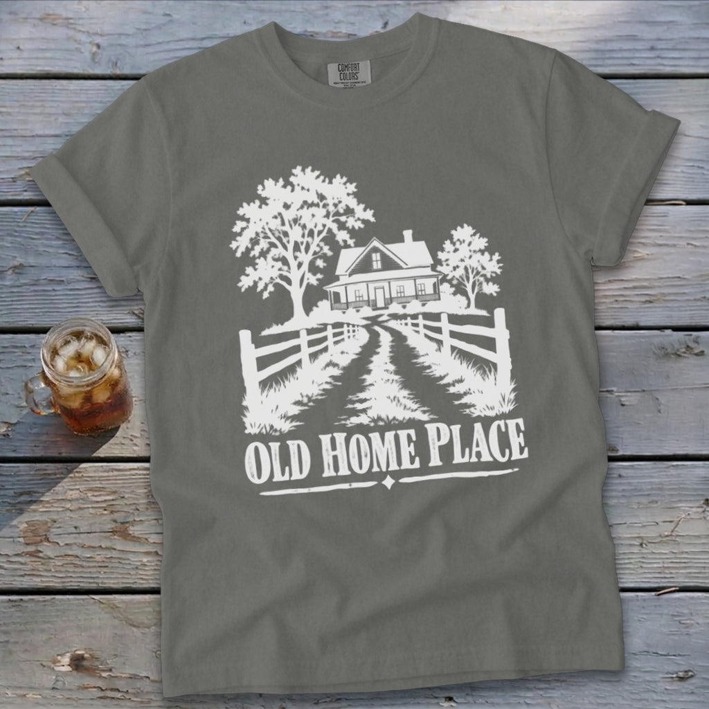 Grey t-shirt with white graphic of a house and trees, reading "Old Home Place".