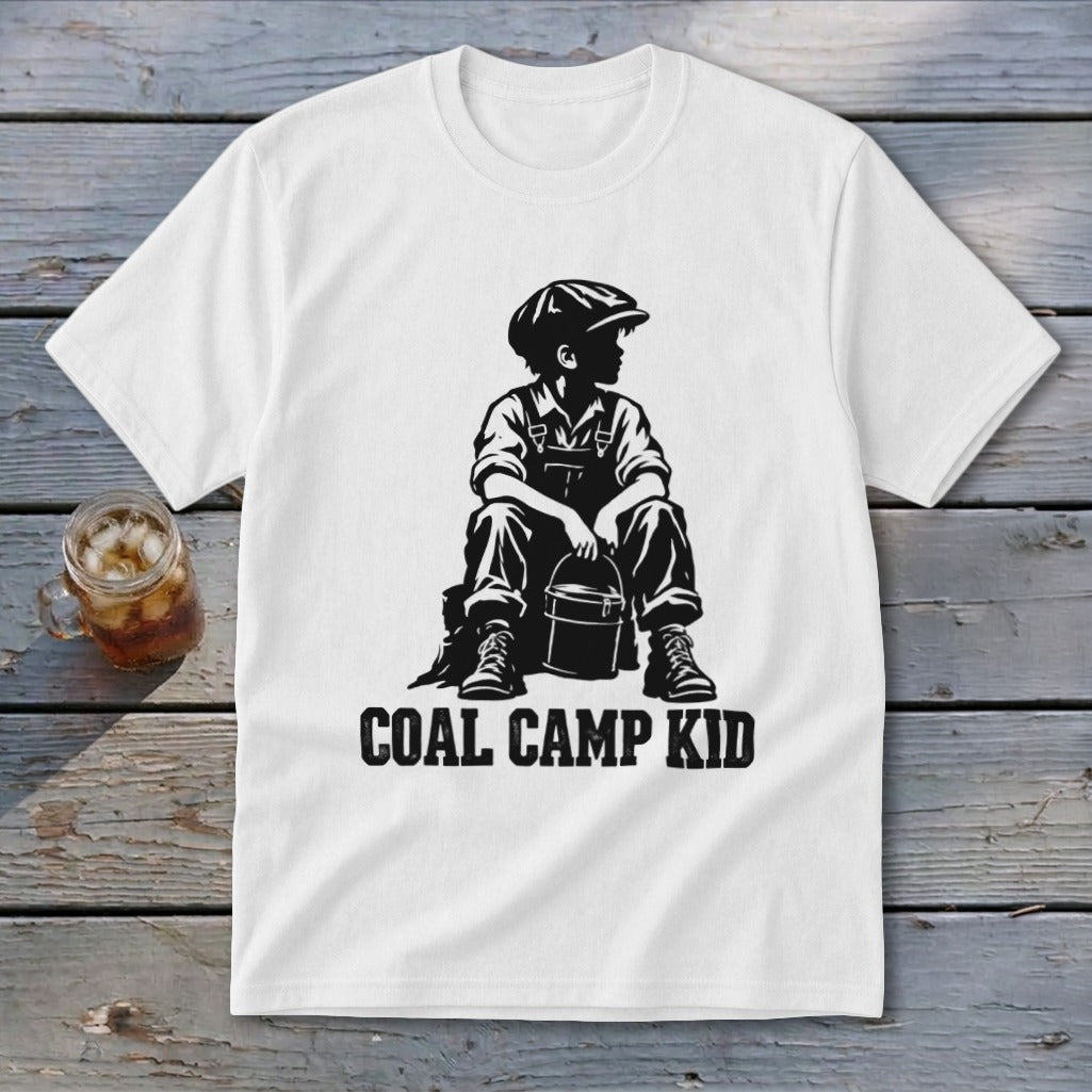 White t-shirt with black graphic of a boy in overalls and cap holding a bucket, text "COAL CAMP KID".