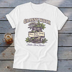 White t-shirt with "Granny Witch" and "Holler-Born Healer" text, featuring herbs in a jar.