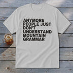 White t-shirt with black text: "ANYMORE PEOPLE JUST DON'T UNDERSTAND MOUNTAIN GRAMMAR".