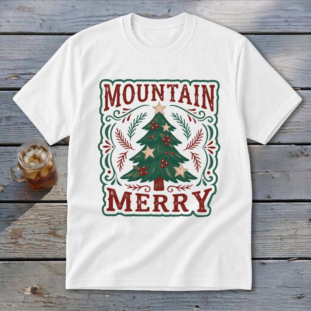 A white short-sleeved t-shirt featuring a vintage Christmas tree graphic with the text Mountain Merry.